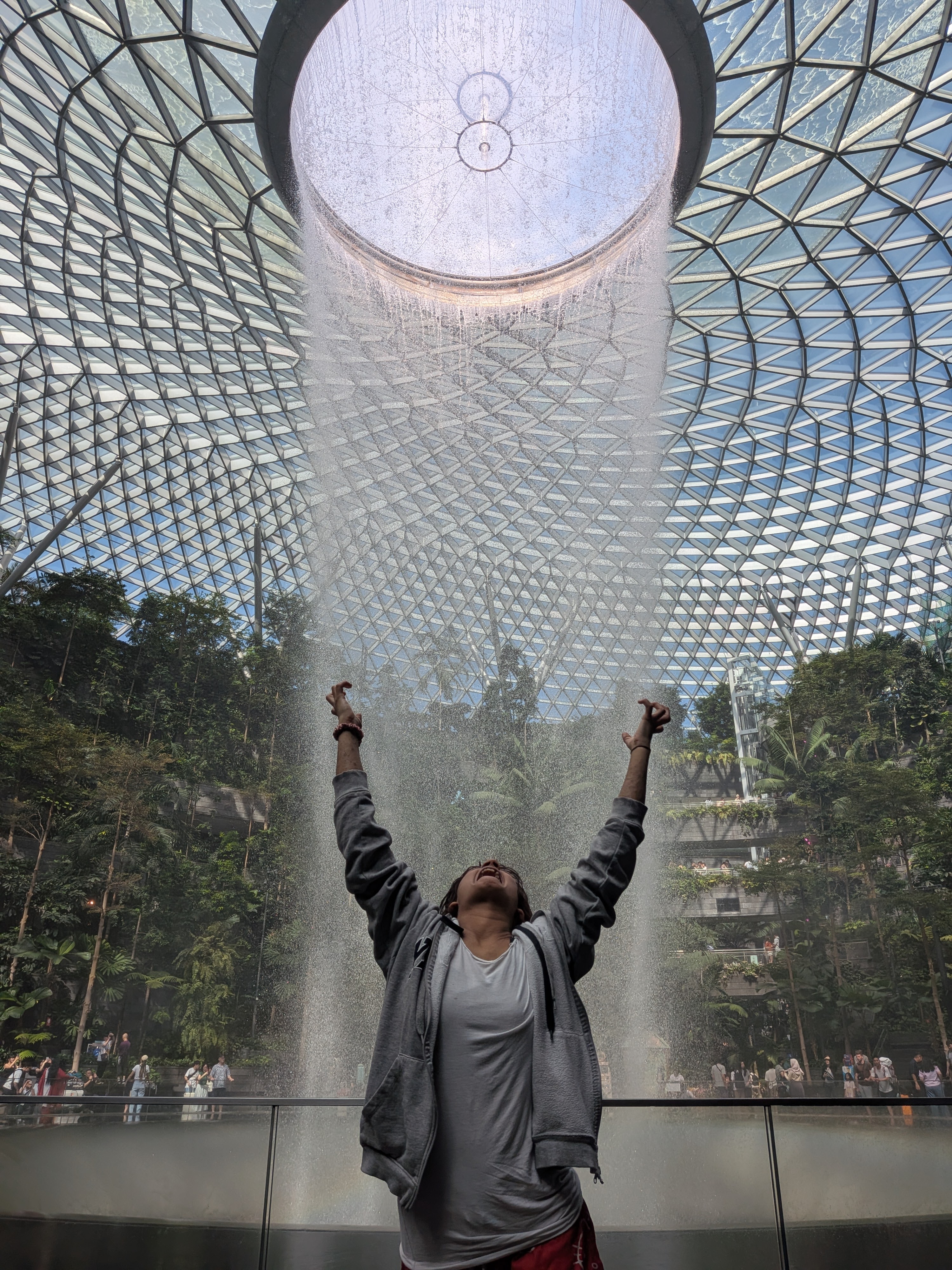 Lu under the rain vortex at Jewel Changi, Singapore